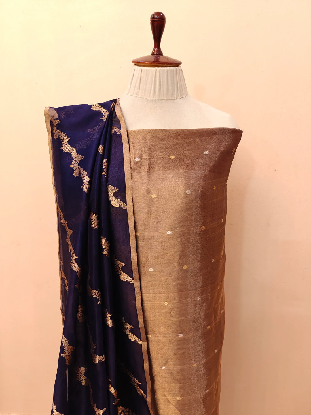 Navy Blue Banarasi Tissue Silk suit with golden and silver Kadhwa butis on the kurta, paired with a Kora silk dupatta featuring intricate jaal work.