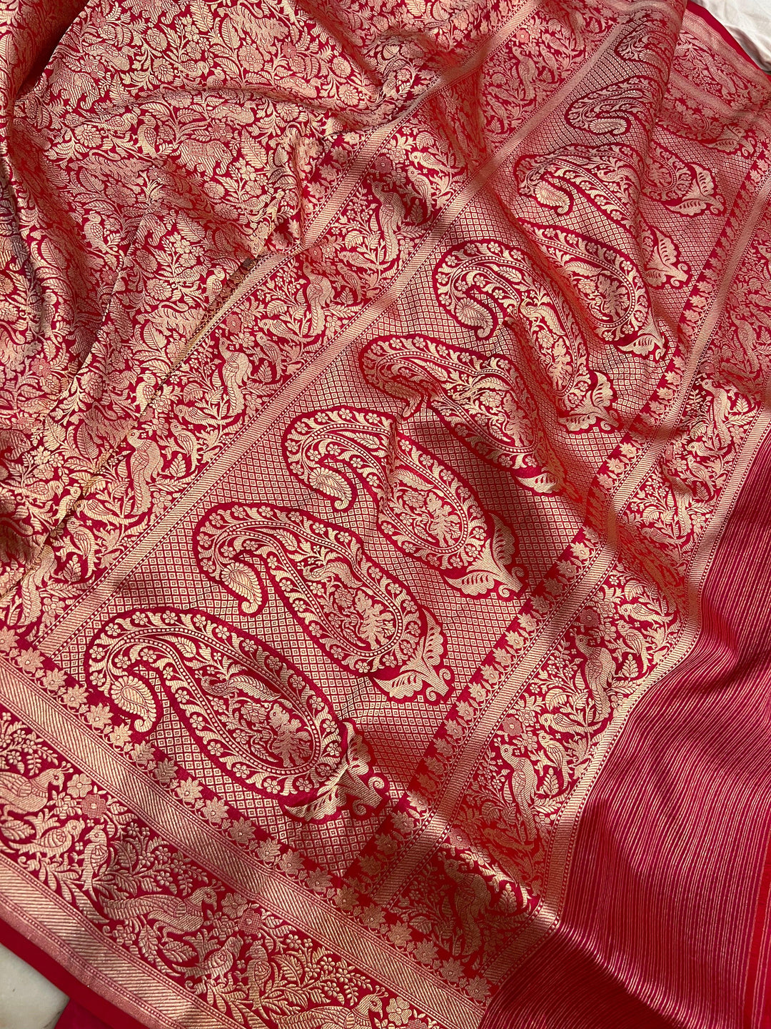 Shikargaah motif pallu with fine cutwork weaving on a Banarasi handloom saree