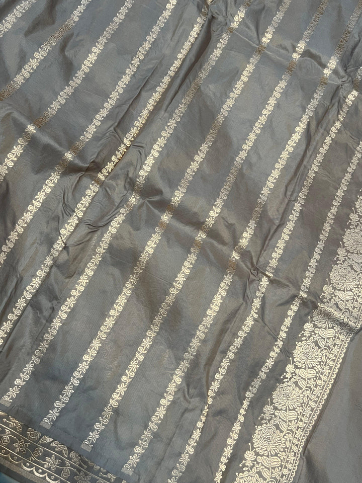 Plain blouse piece with golden zari lines included with the pure Katan silk Banarasi saree