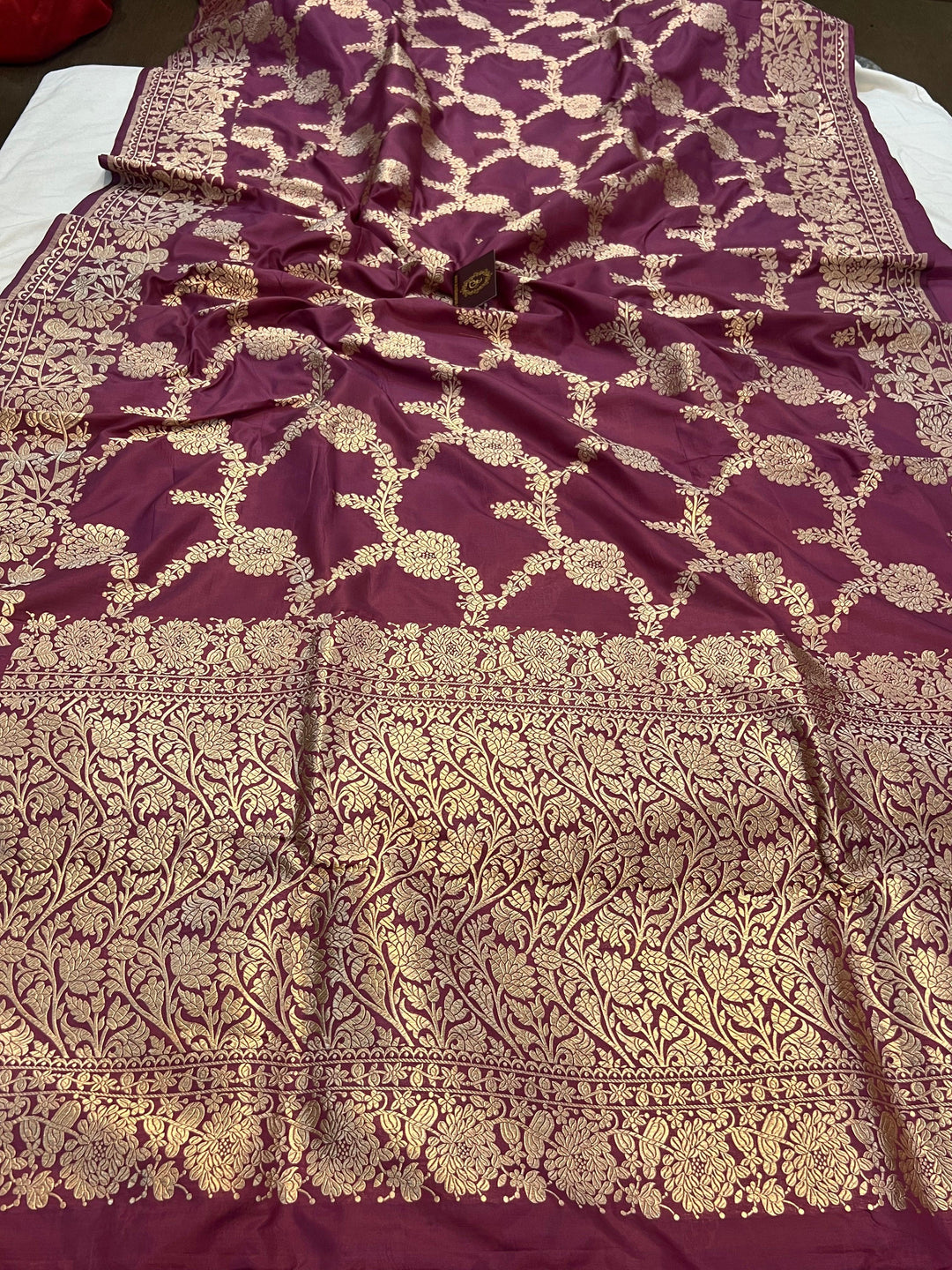 Pure Katan silk handloom saree draped with light golden zari floral jaal and elegant border
