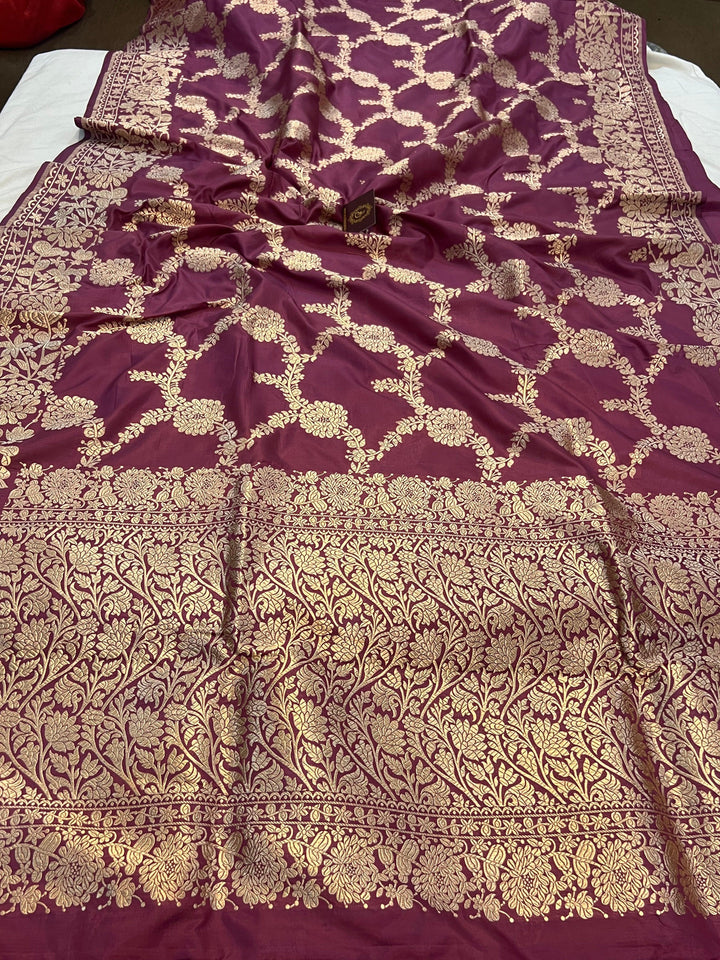 Pure Katan silk handloom saree draped with light golden zari floral jaal and elegant border