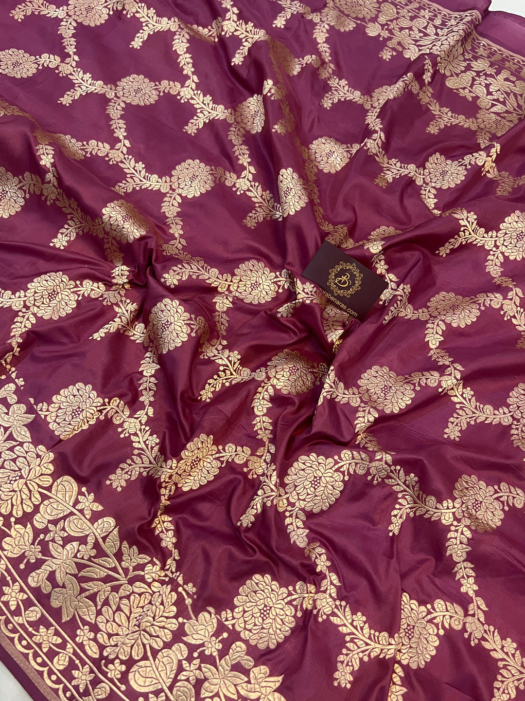 Light golden zari border and palla beautifully complementing the floral jaal design on Katan silk saree