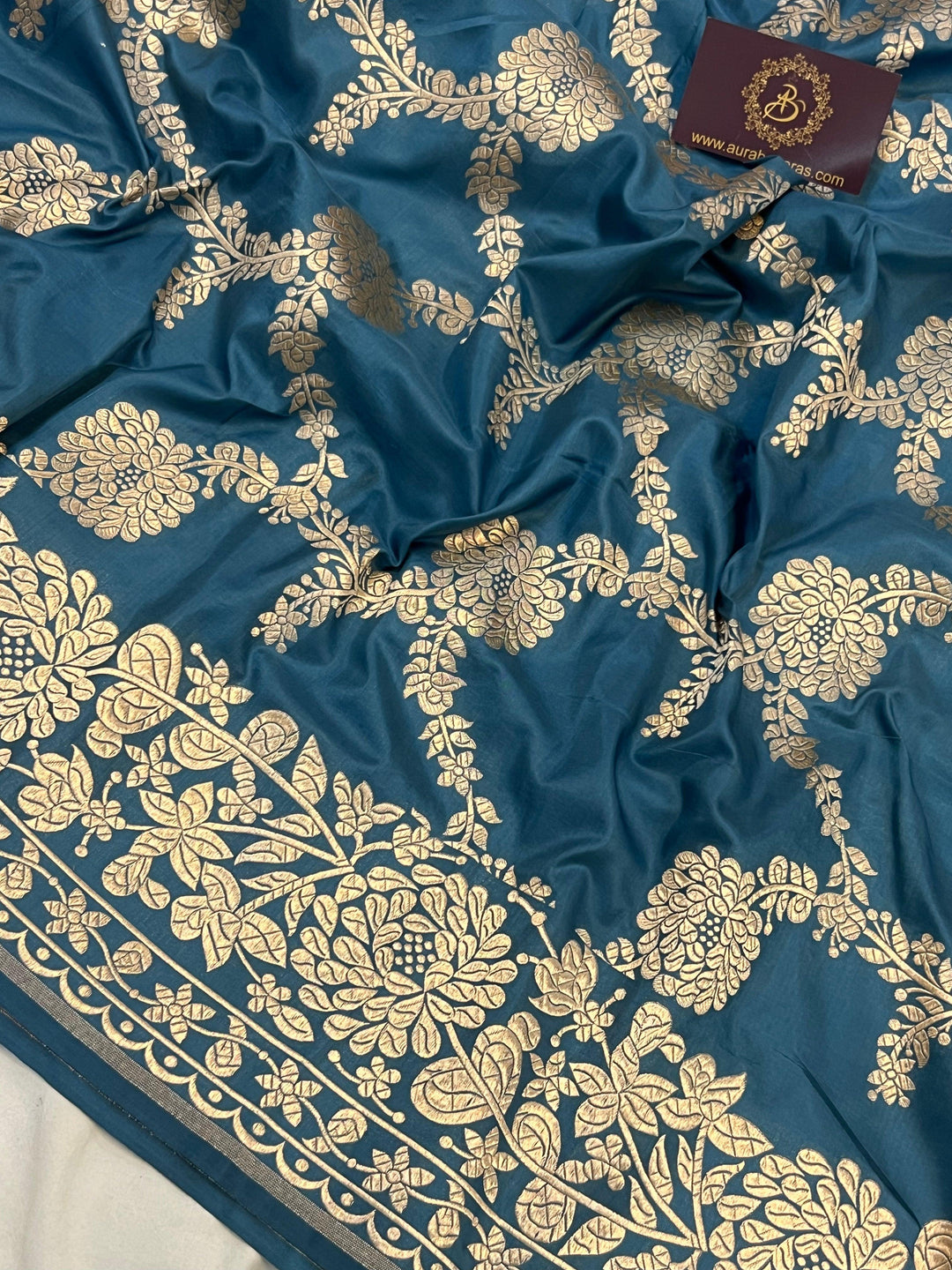 Detailed floral jaal woven in light golden zari on pure Katan silk handloom Banarasi saree