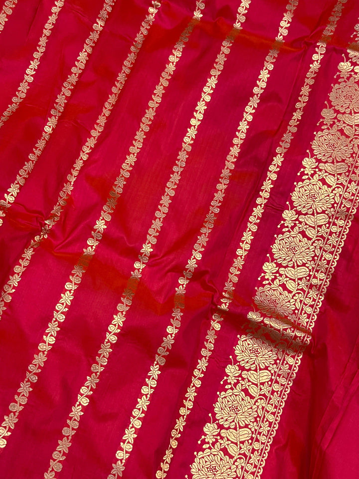 Plain blouse piece with golden zari lines included with the pure Katan silk Banarasi saree