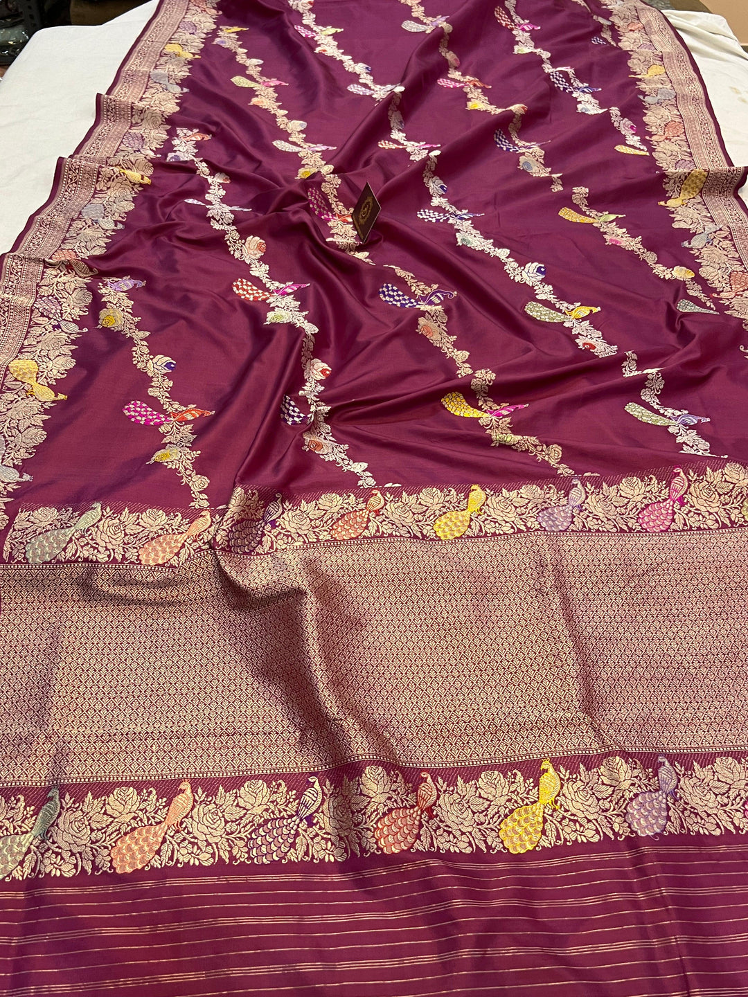 Detailed pallu of Banarasi Katan silk saree with vibrant Meenakari and gold zari border – available online
