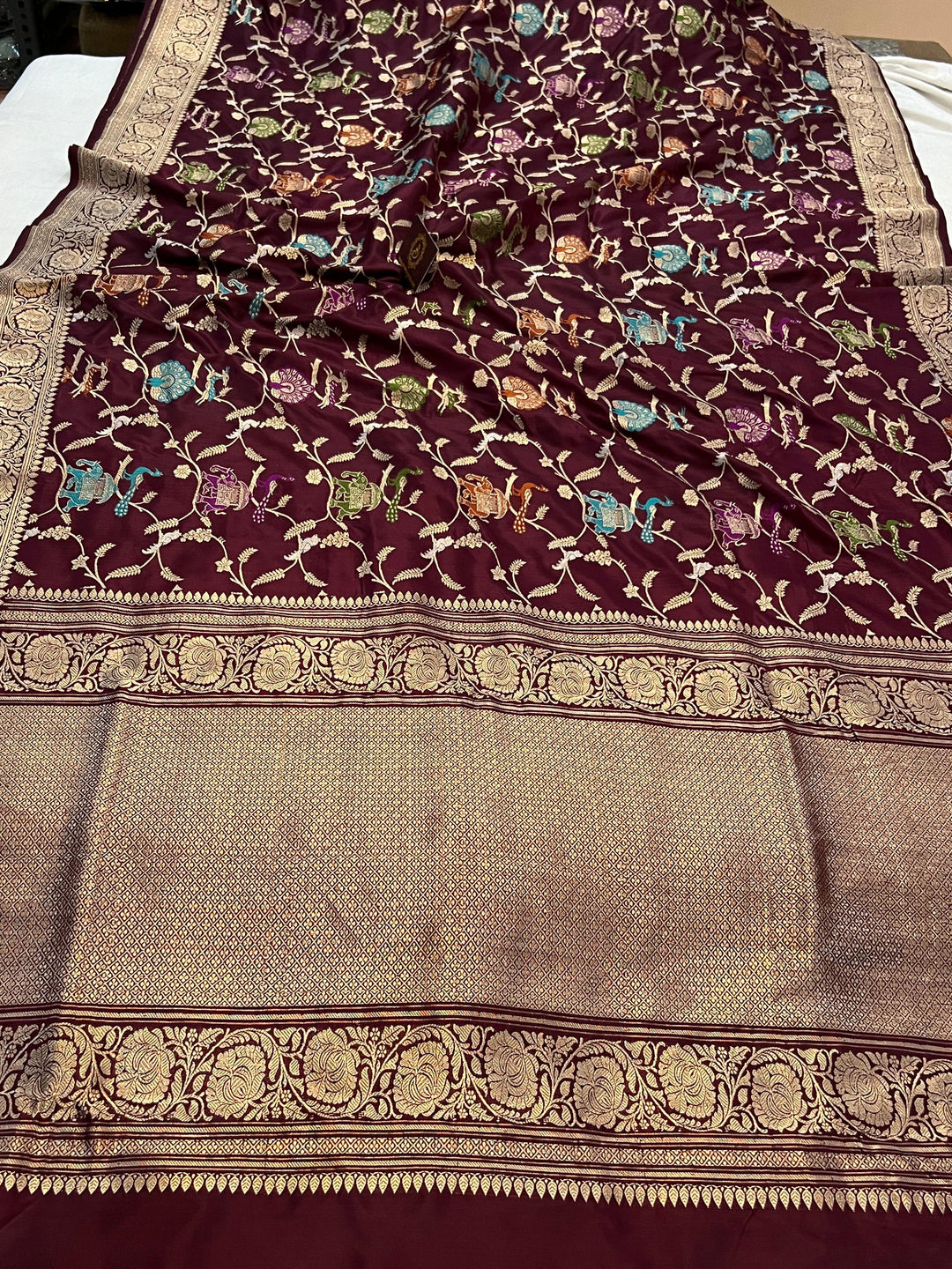 Kadhwa woven pallu of Banarasi silk saree with Shikargah Jaal and Meenakari work