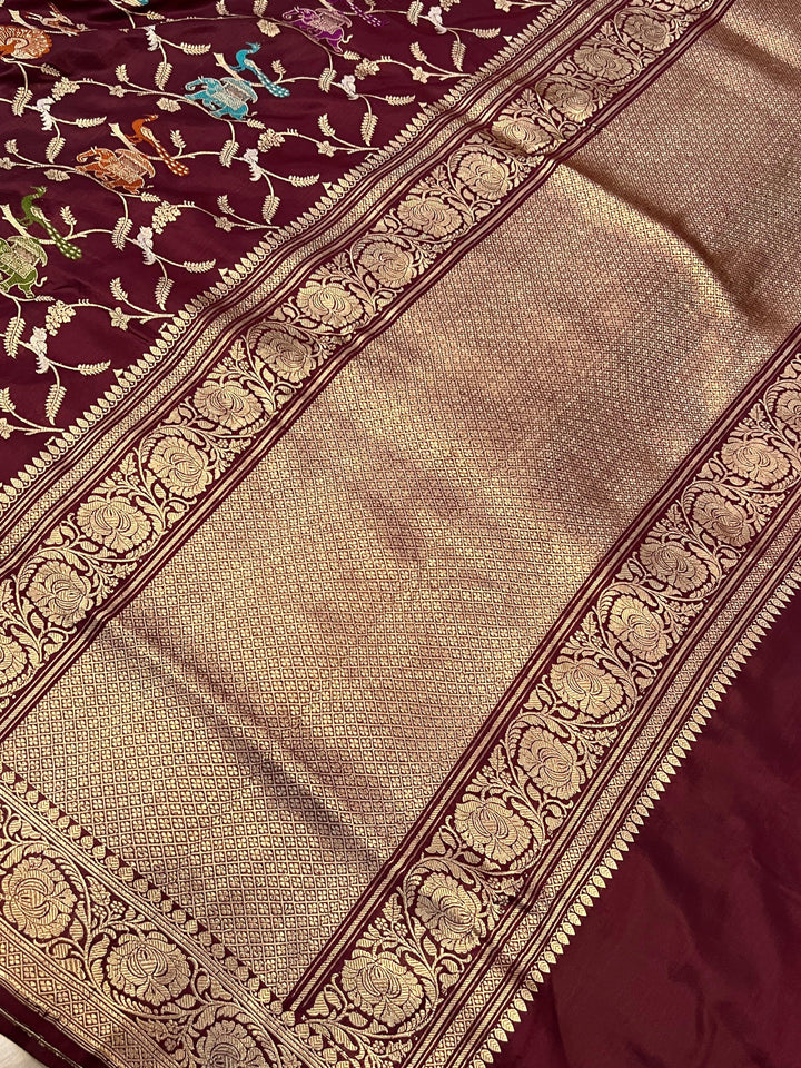 Kadhwa woven pallu of Banarasi silk saree with Shikargah Jaal and Meenakari work