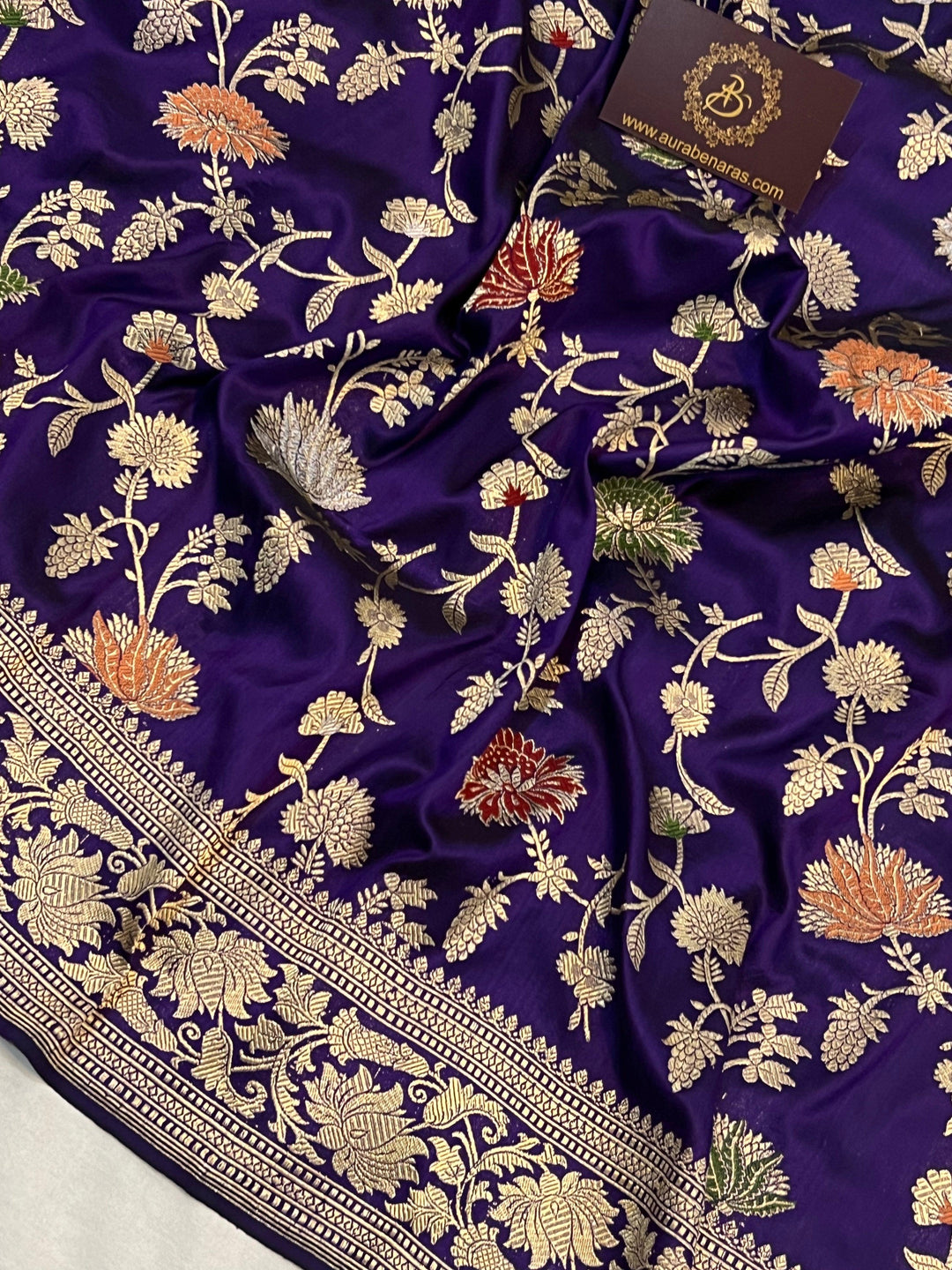 Colorful Meenakari Jaal work on Banarasi Katan silk saree with handwoven floral motifs