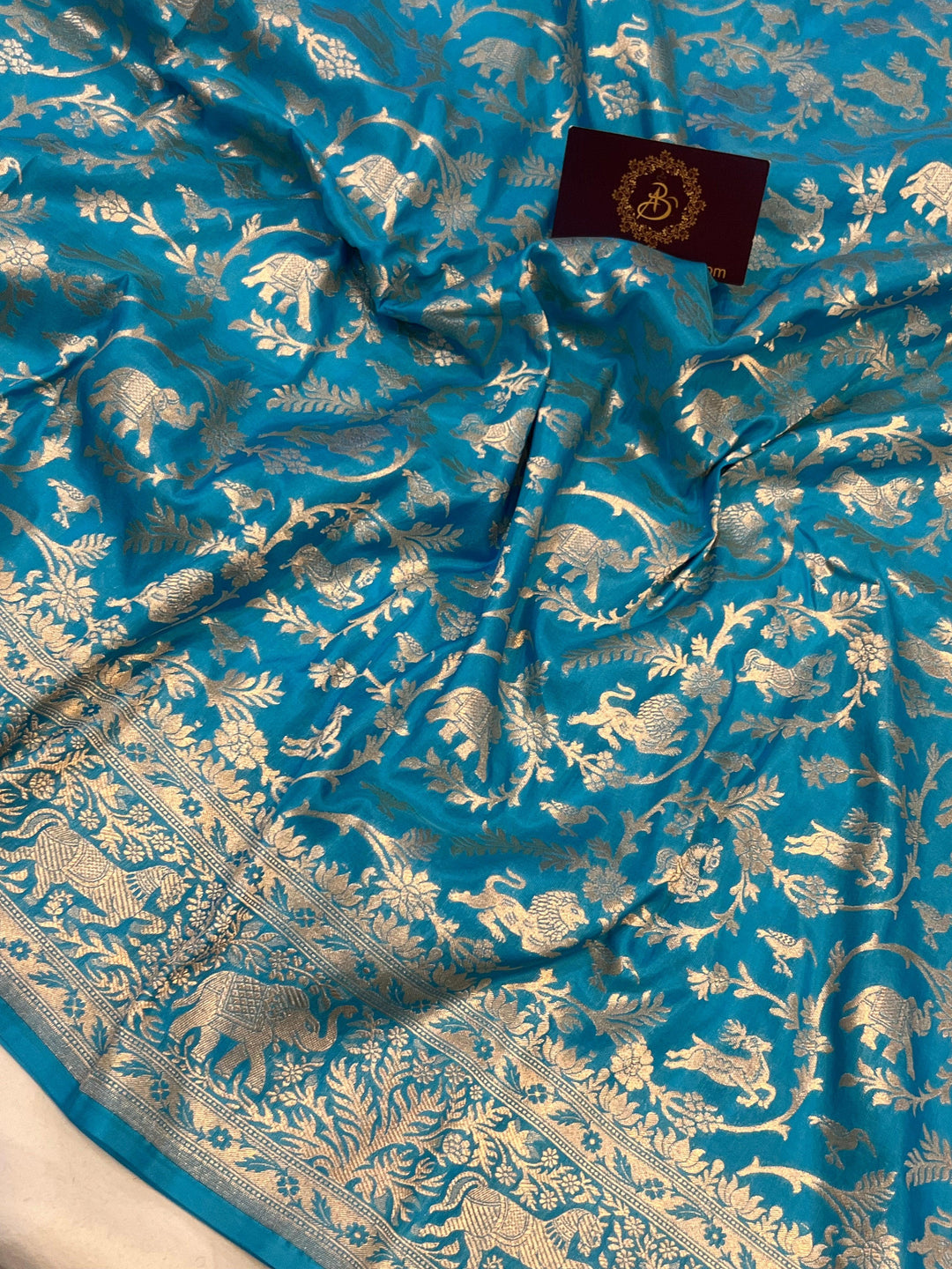 Cutwork weave detail on Katan silk fabric with traditional Shikargaah pattern