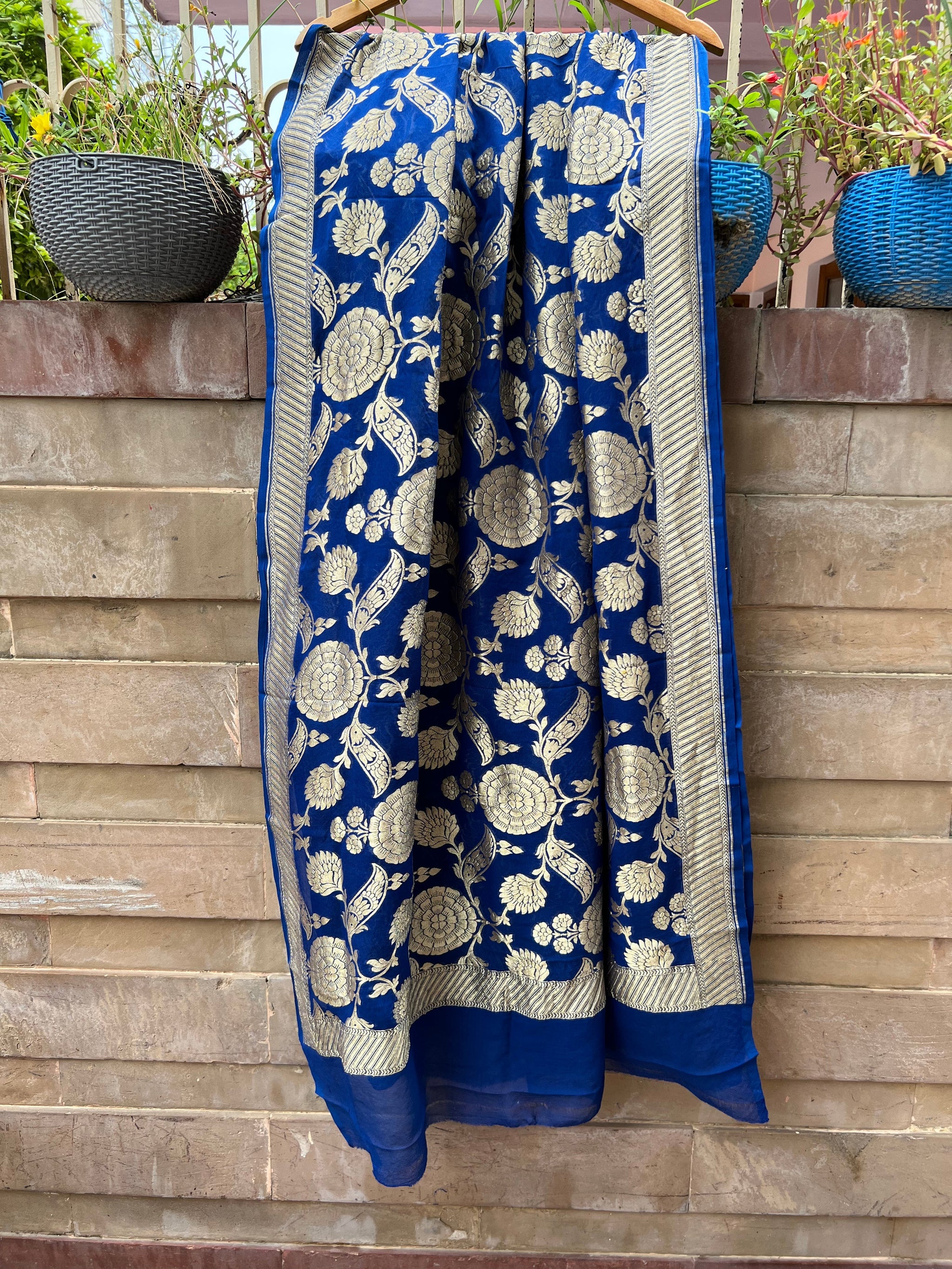 Orange and Blue Banarsi deals dupatta with golden jari work.