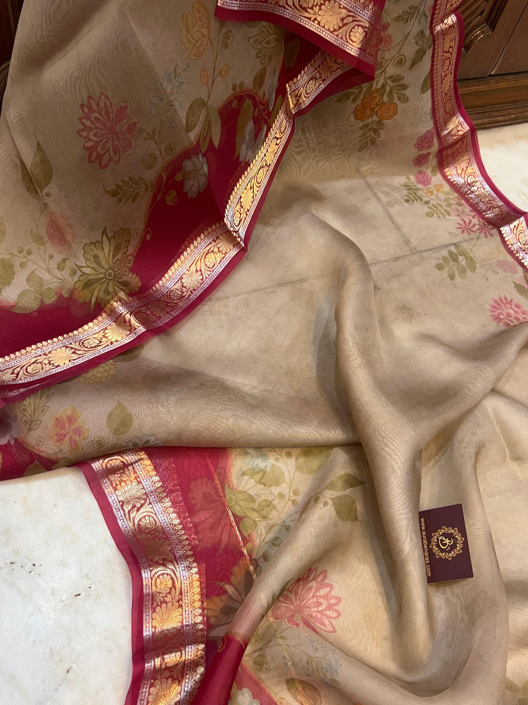 Pure Banarasi Kora silk saree with floral digital print, golden zari Banarasi border, and matching Chiniya silk blouse piece—ideal for festive and elegant occasions.