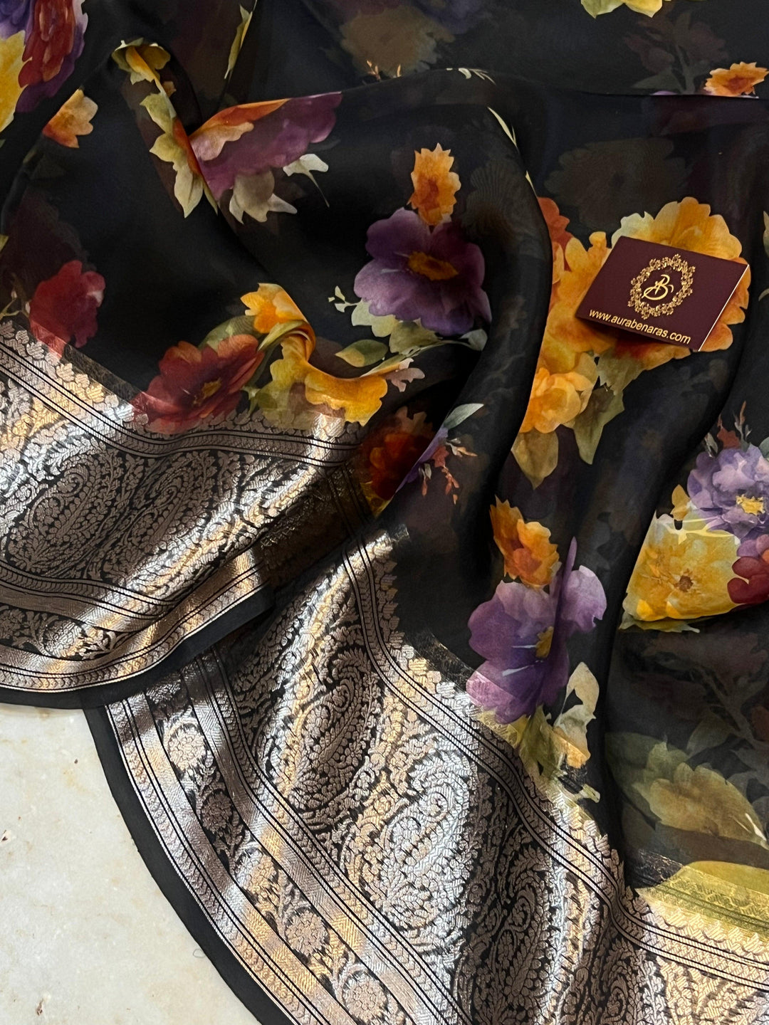 Pure Banarasi Kora silk saree with floral digital print, silver zari Banarasi border, and matching Chiniya silk blouse piece—ideal for festive and elegant occasions.