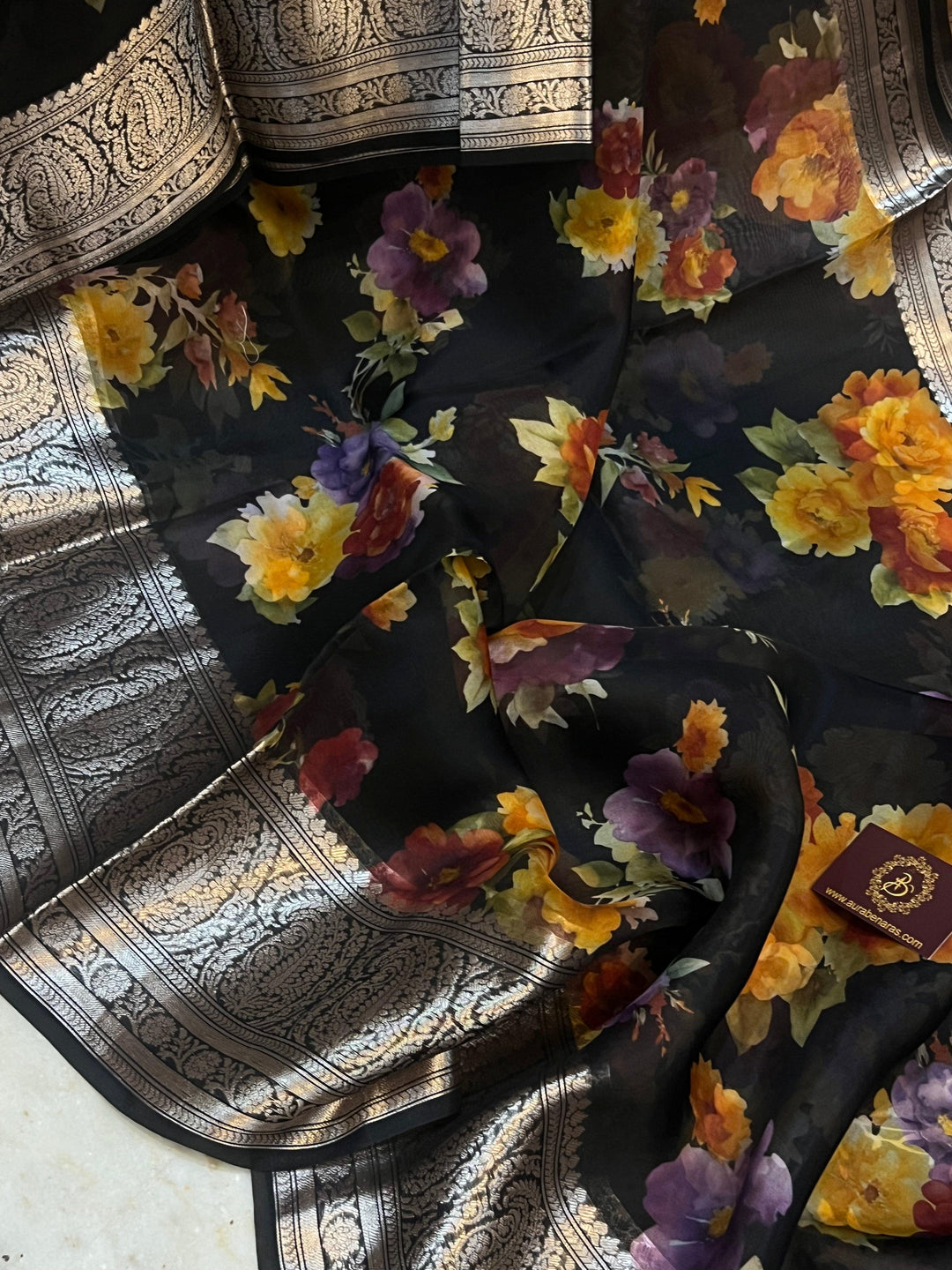 Pure Banarasi Kora silk saree with floral digital print, silver zari Banarasi border, and matching Chiniya silk blouse piece—ideal for festive and elegant occasions.