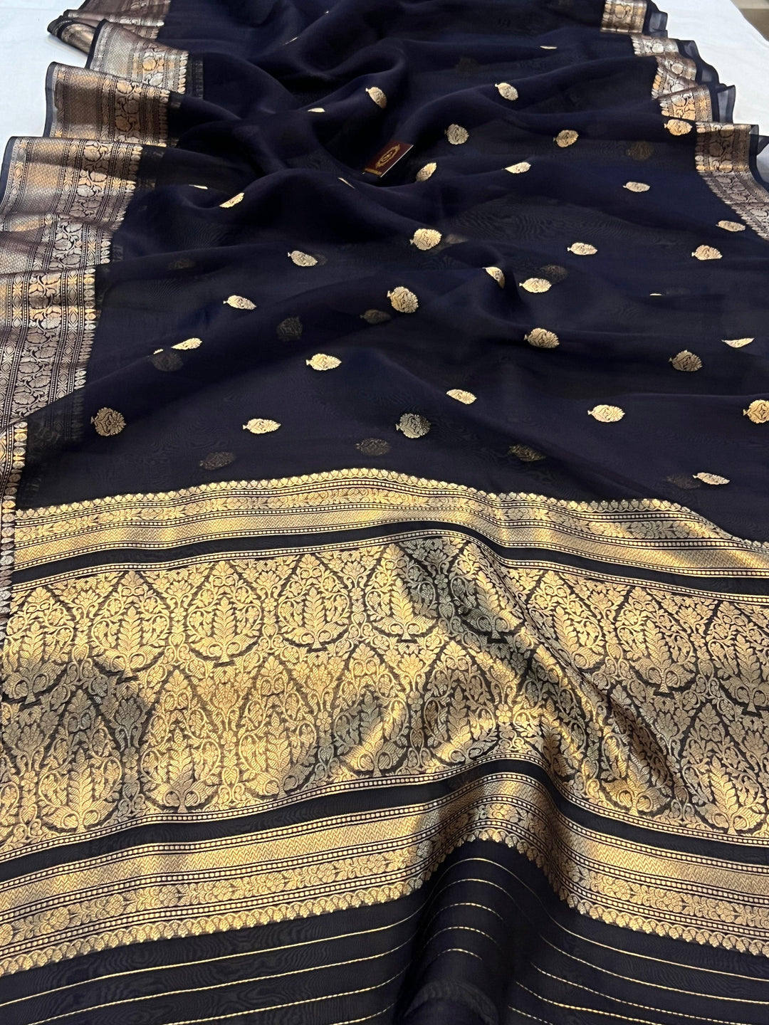 Pure Banarasi handloom Kora silk saree by Aura Benaras, featuring intricate Kadhwa butas and a beautiful traditional Banarasi border—ideal for weddings, festive wear, and special occasions.