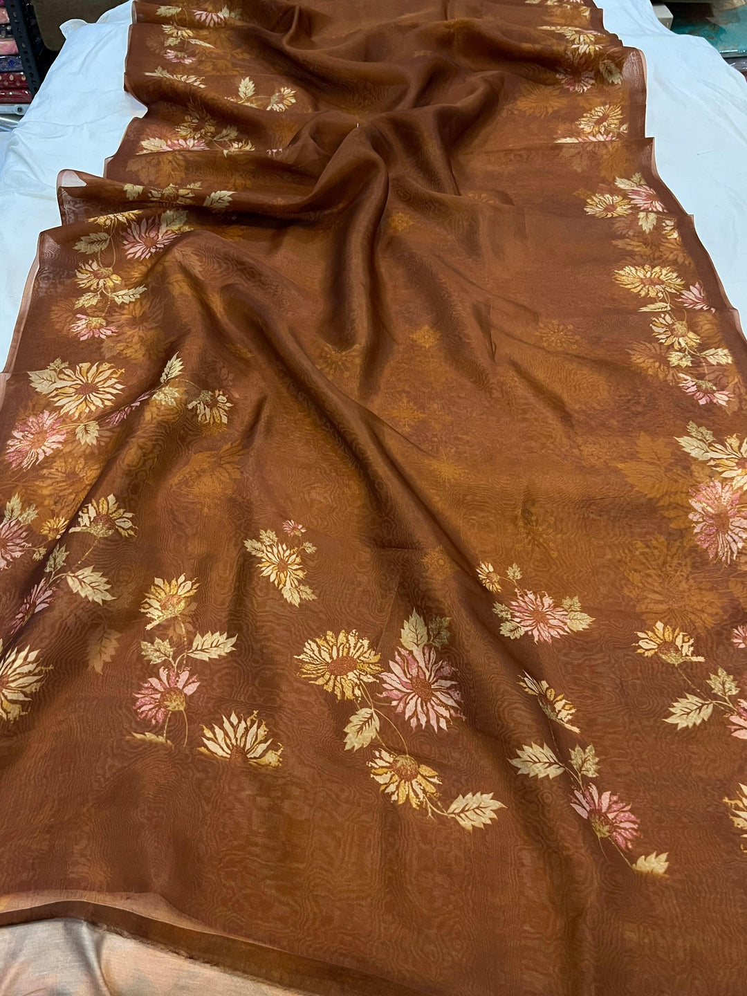 Pure Banarasi handloom Kora silk saree by Aura Benaras featuring floral digital print, designer borderless design, and a matching Chiniya silk blouse piece—perfect for festive and elegant occasions.