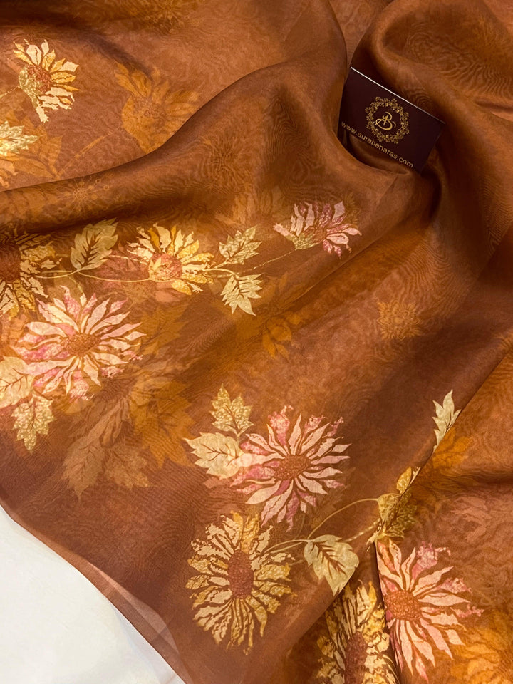Pure Banarasi handloom Kora silk saree by Aura Benaras featuring floral digital print, designer borderless design, and a matching Chiniya silk blouse piece—perfect for festive and elegant occasions.