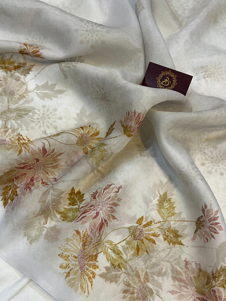 Pure Banarasi handloom Kora silk saree by Aura Benaras featuring floral digital print, designer borderless design, and a matching Chiniya silk blouse piece—perfect for festive and elegant occasions.