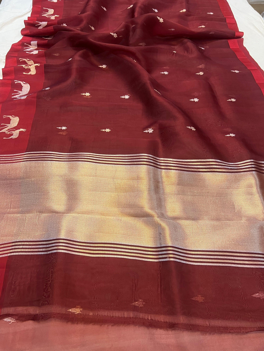 Pure Kora silk handloom Banarasi saree draped with Kadhwa Sona Rupa butis, Mashru silk border featuring hiran motifs, and elegant designer pallu