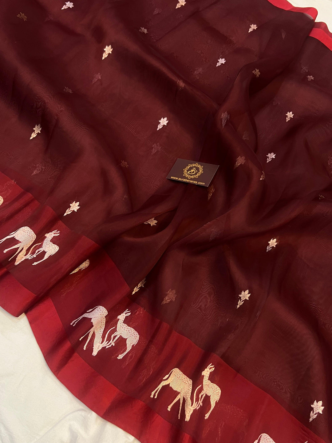 Mashru silk border with traditional hiran (deer) motifs in rich golden zari on pure Kora silk Banarasi saree