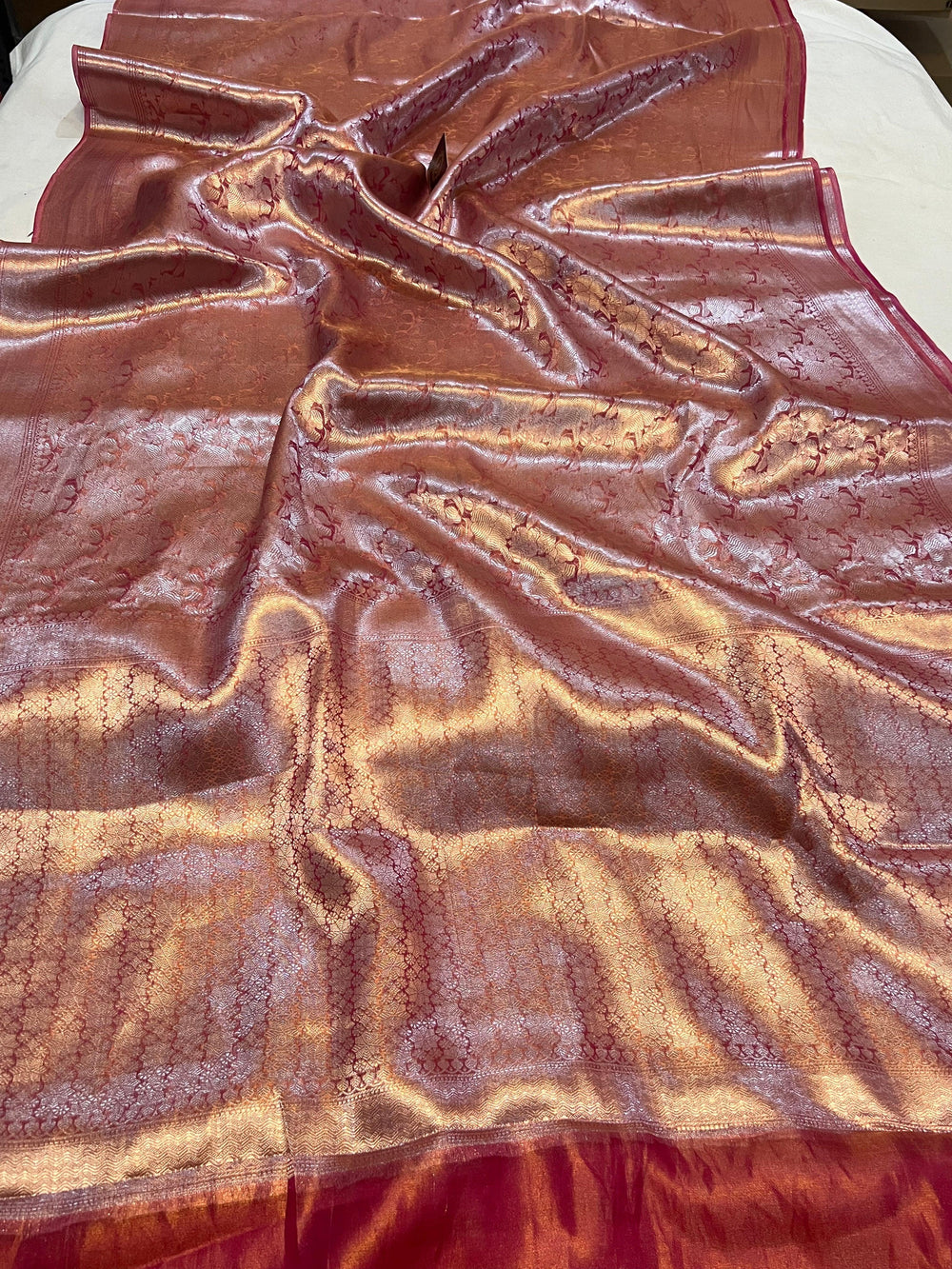 Pure Banarasi handloom tissue silk saree by Aura Benaras featuring intricate brocade work and a plain blouse piece—ideal for weddings and festive occasions