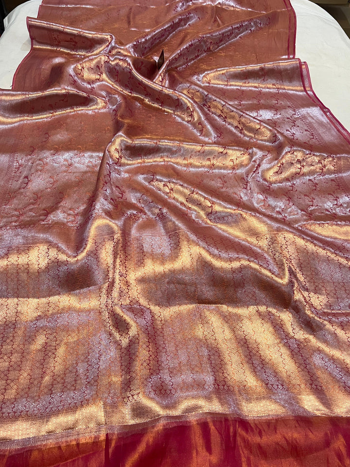 Pure Banarasi handloom tissue silk saree by Aura Benaras featuring intricate brocade work and a plain blouse piece—ideal for weddings and festive occasions