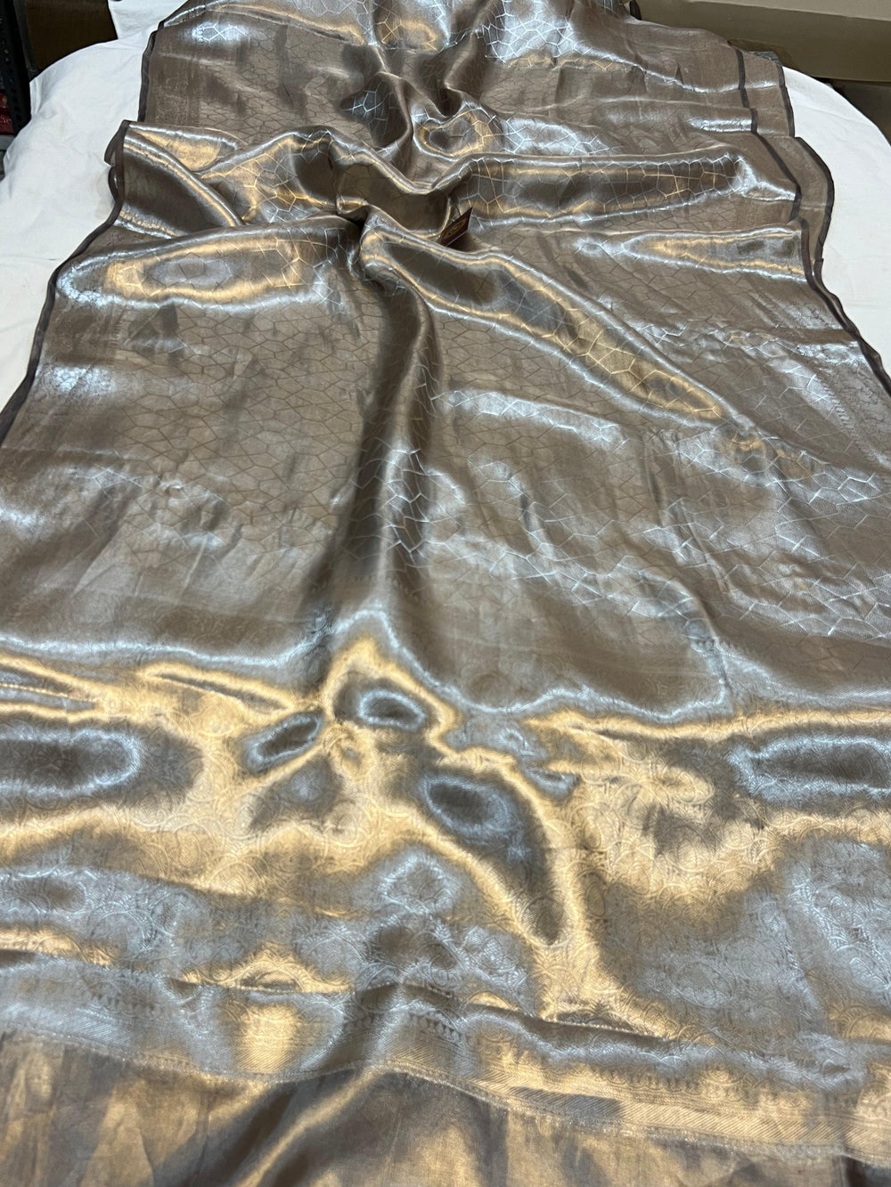 Pure Banarasi handloom tissue silk saree by Aura Benaras featuring intricate brocade work and a plain blouse piece—ideal for weddings and festive occasions.