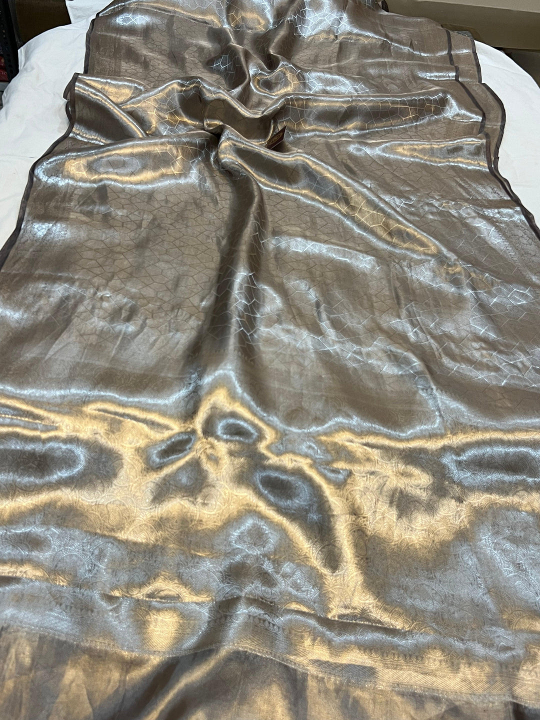 Pure Banarasi handloom tissue silk saree by Aura Benaras featuring intricate brocade work and a plain blouse piece—ideal for weddings and festive occasions.