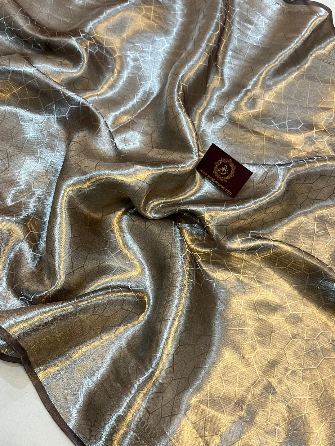 Pure Banarasi handloom tissue silk saree by Aura Benaras featuring intricate brocade work and a plain blouse piece—ideal for weddings and festive occasions.