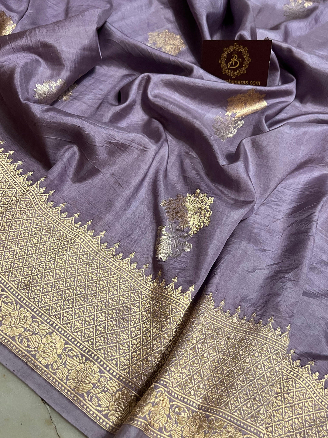 Intricate Kadhwa Sona Rupa motifs in gold and silver zari on Banarasi silk saree