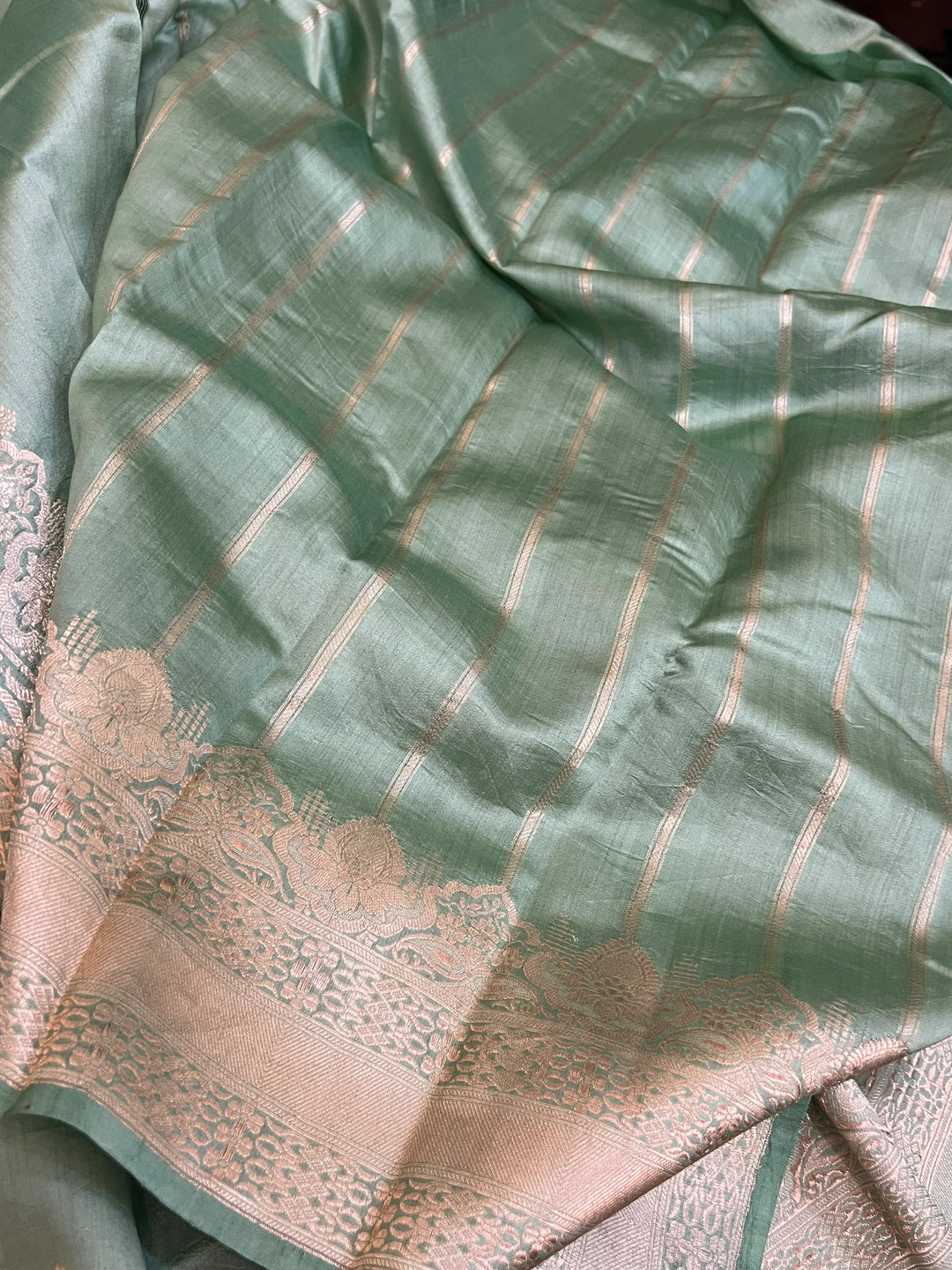 Striped blouse piece that complements the Sage Green Chiniya silk Banarasi saree