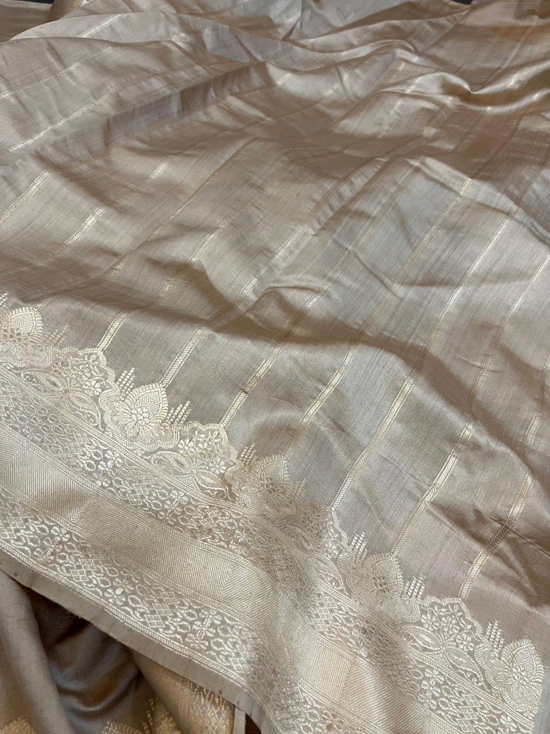 Striped blouse piece paired with Beige Chiniya silk Banarasi saree