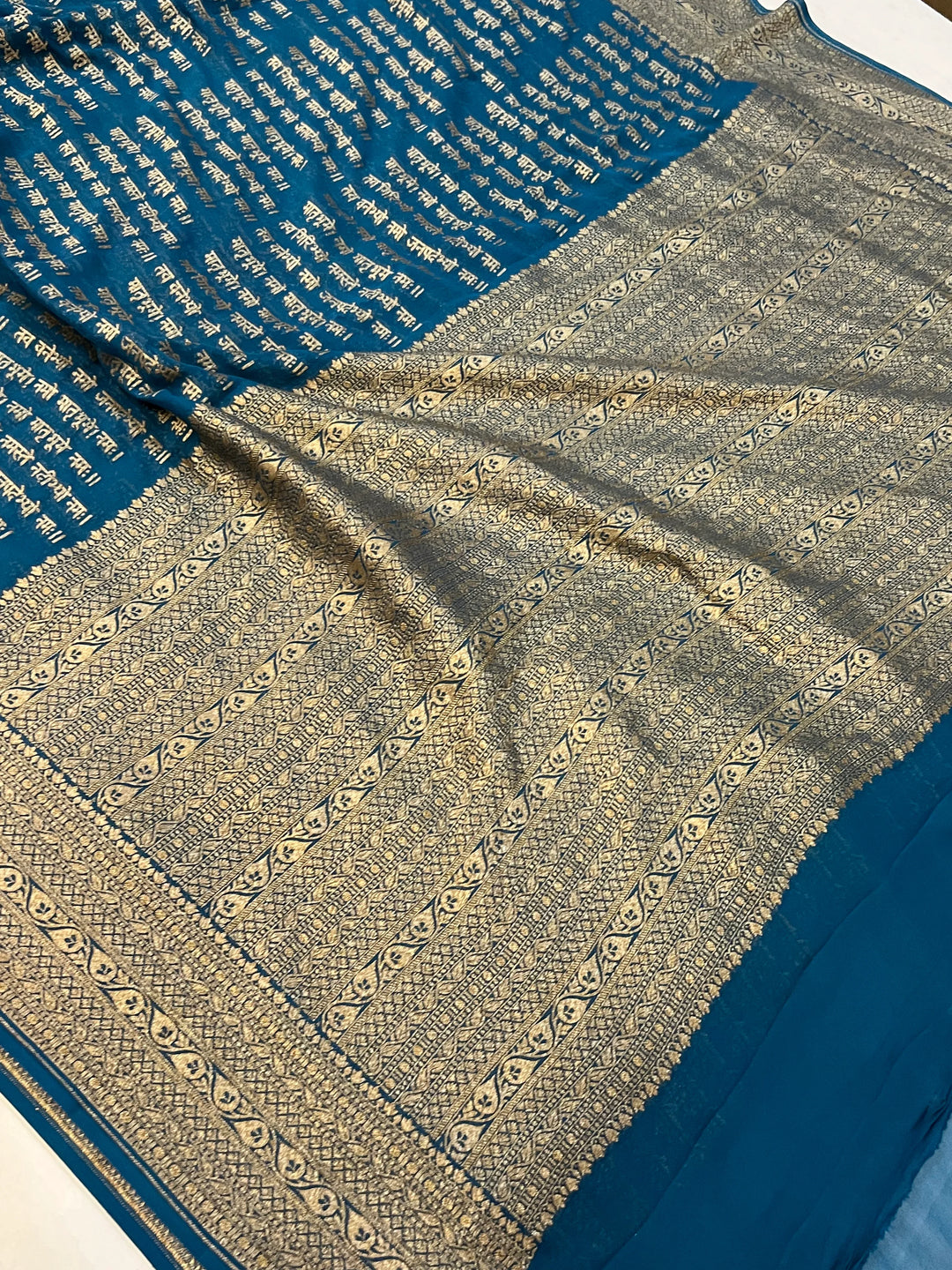 Teal Blue Pure Banarasi Khaddi Georgette saree with antique zari and Sanskrit shloka motifs