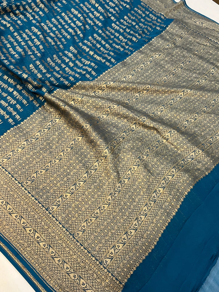 Teal Blue Pure Banarasi Khaddi Georgette saree with antique zari and Sanskrit shloka motifs