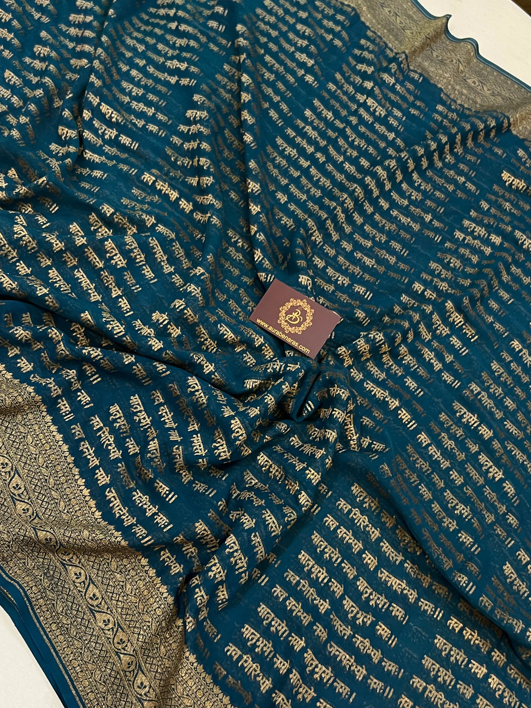 Teal Blue Pure Banarasi Khaddi Georgette saree with antique zari and Sanskrit shloka motifs