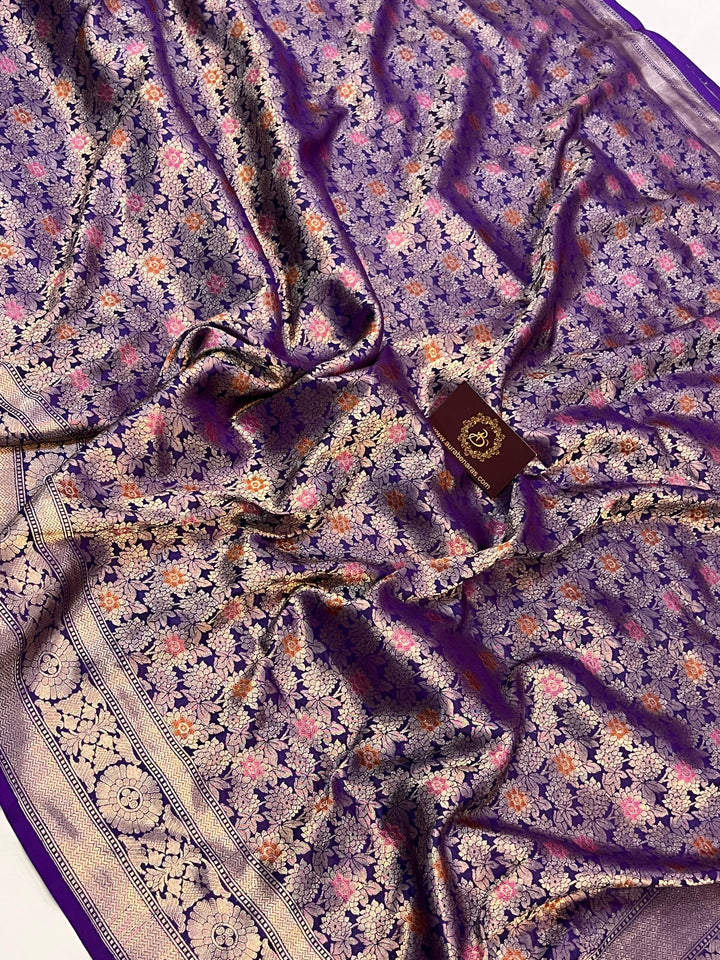 Traditional Banarasi border with golden zari and meenakari accents on pure Katan silk saree