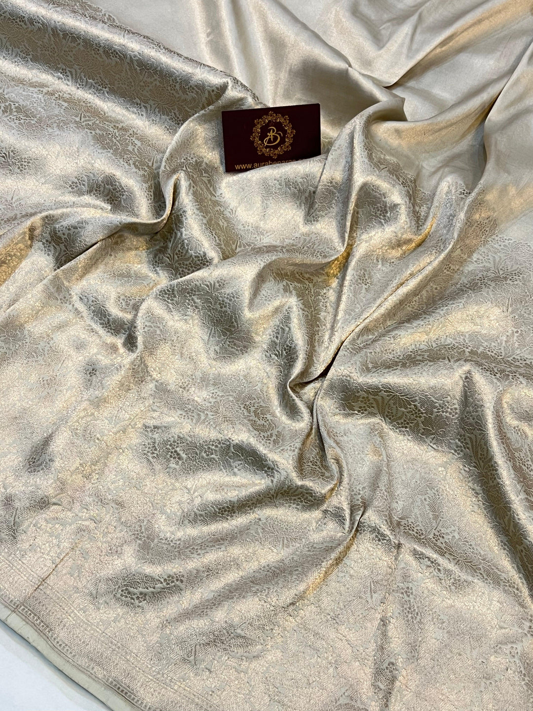 Intricate floral brocade weaving on lower half of pure Katan silk Banarasi saree