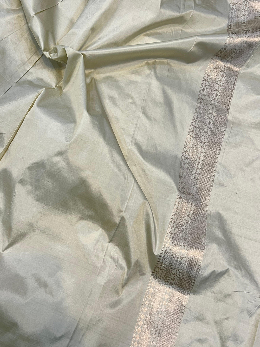 Plain blouse piece included with pure Katan silk Banarasi saree to balance the floral brocade work