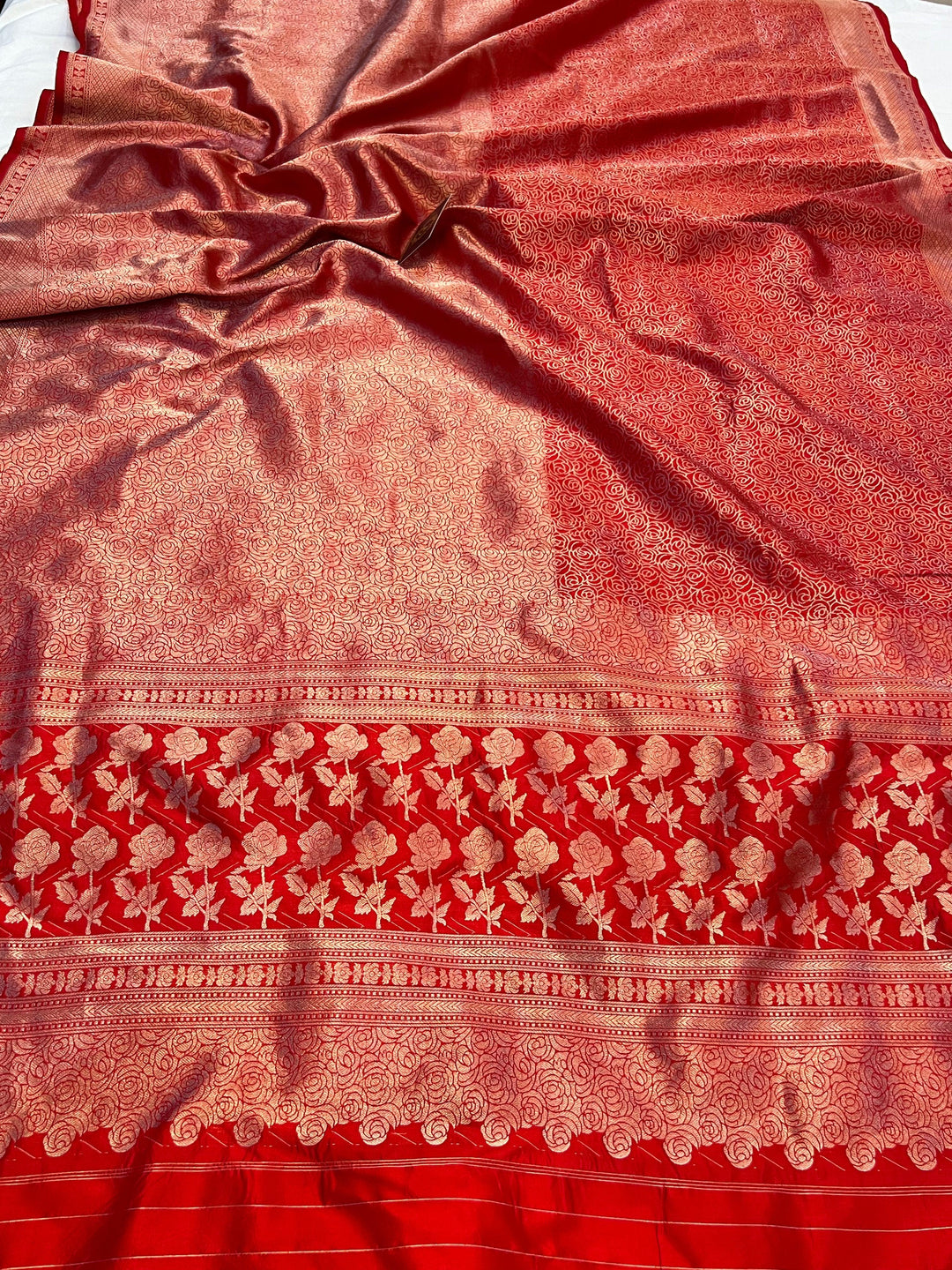 Pure Katan silk handloom Banarasi saree with floral brocade design in lower half and outlined floral pattern in upper half