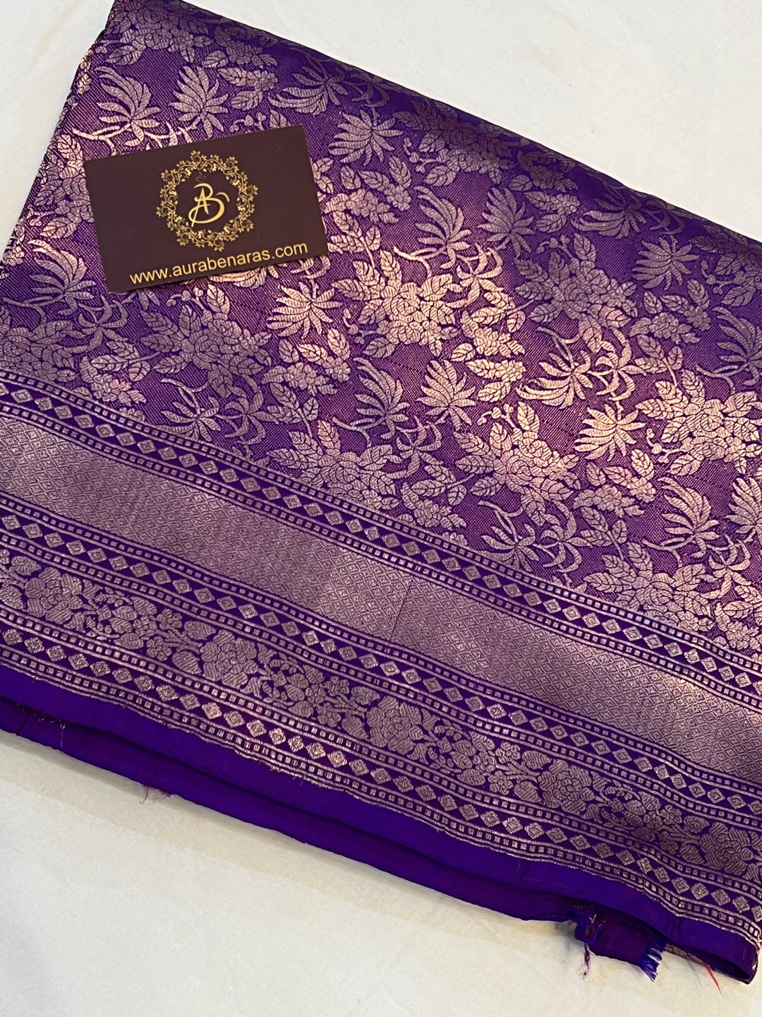 Folded view of pure Katan silk handloom Banarasi saree showcasing allover floral brocade design and rich pallu