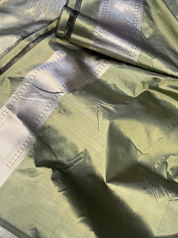 Woven dots creating a 3D effect in the middle section of pure Katan silk Banarasi saree