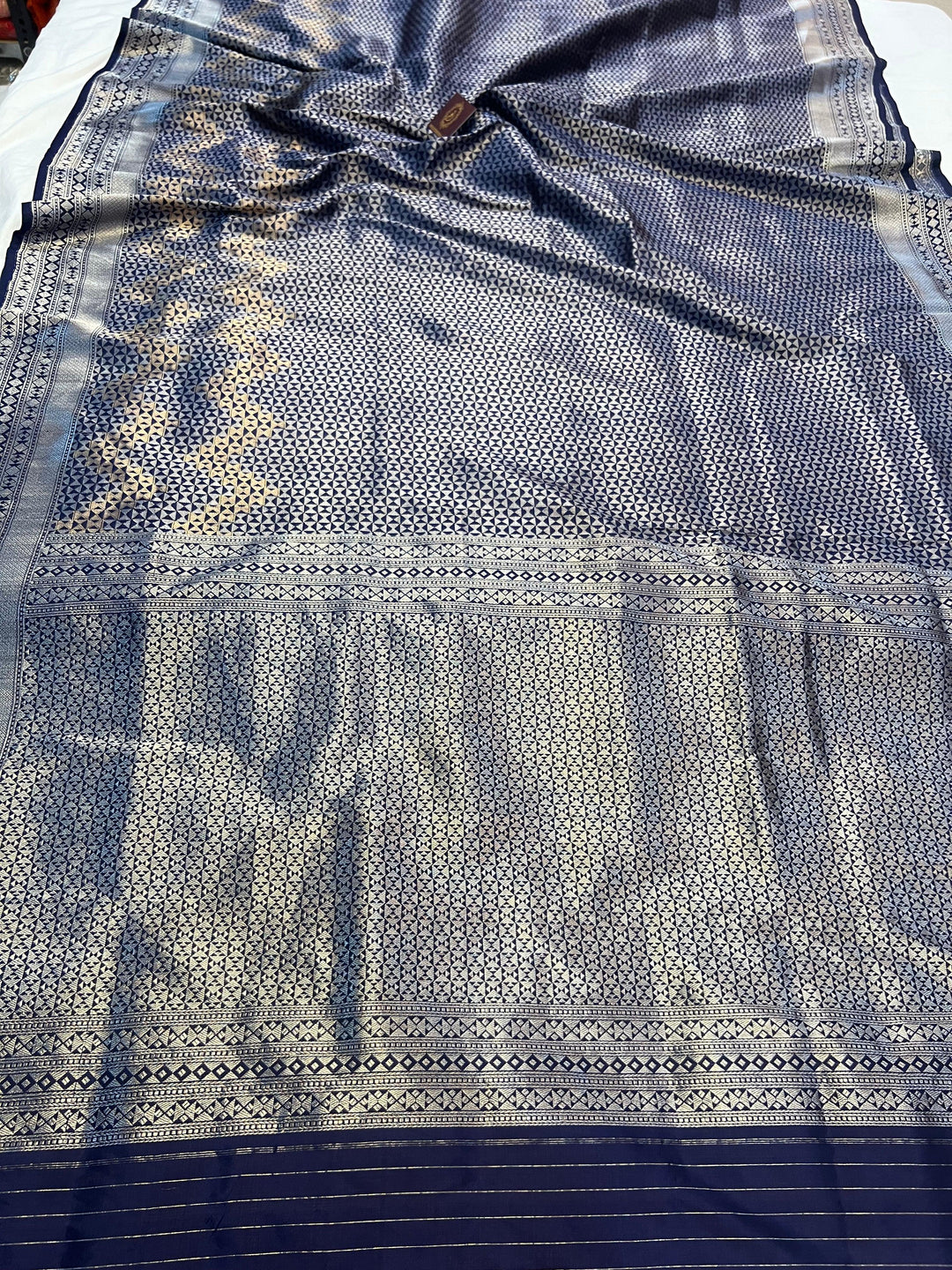 Pure Katan silk handloom Banarasi saree with silver geometric brocade and golden zig-zag skirt pattern