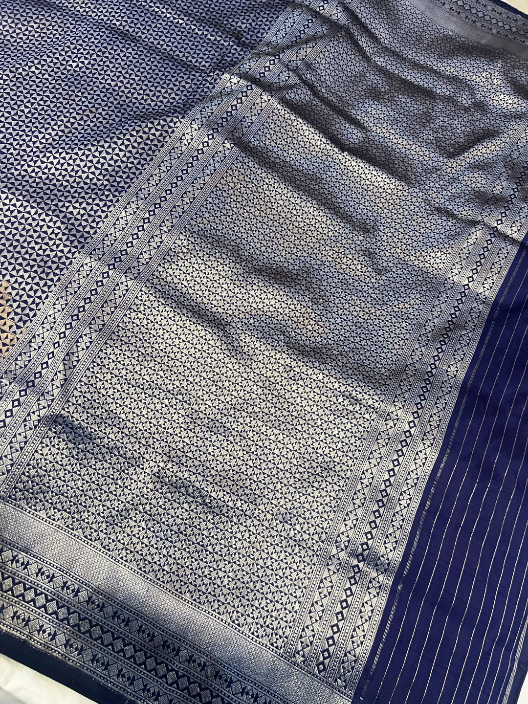 Designer border of pure Katan silk handloom Banarasi saree complementing the geometric and zig-zag patterns