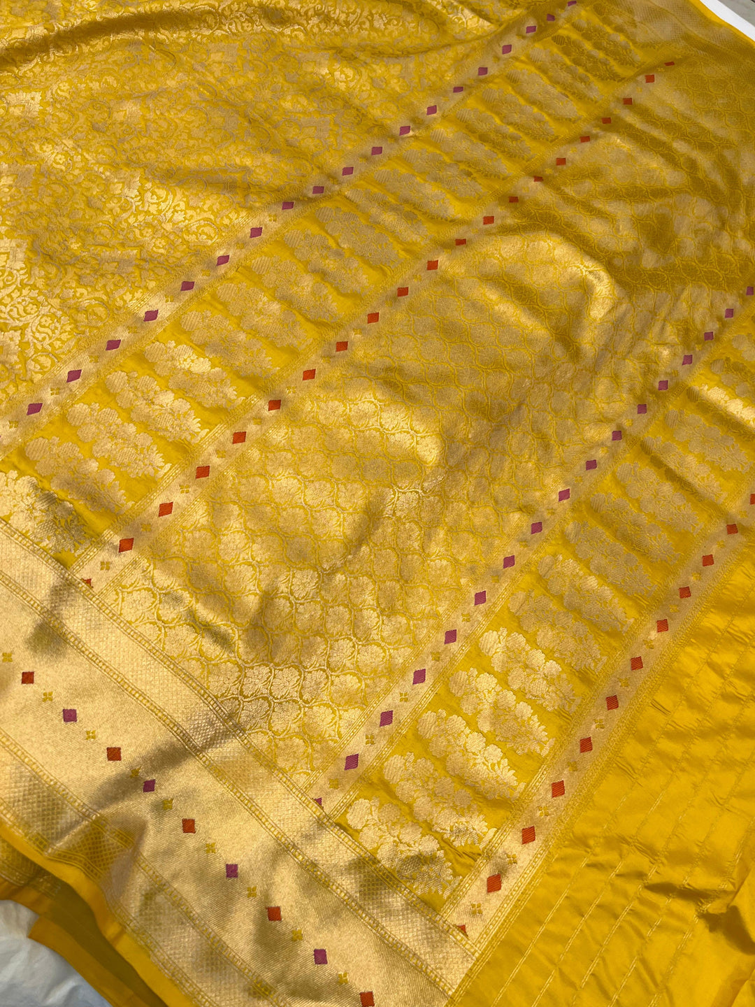 Rich pallu of pure Katan silk handloom Banarasi saree highlighting the golden zari geometric design