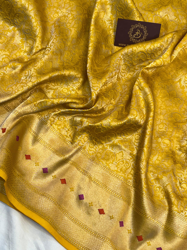 Golden zari geometric brocade work on pure Katan silk Banarasi saree with Meenakari border