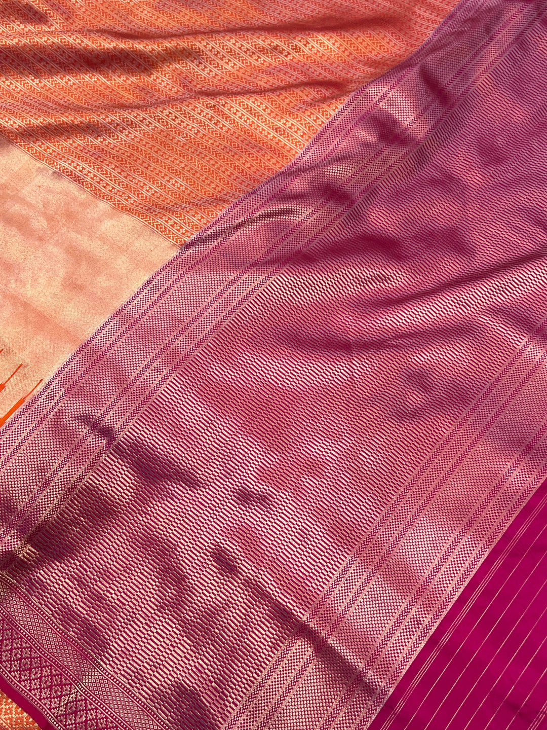 Elegant pallu of pure Katan silk Banarasi saree showcasing the temple border and designer lines