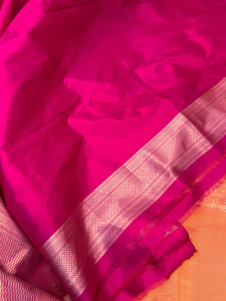 Contrast rani pink blouse piece with matching border for pure Katan silk Banarasi saree