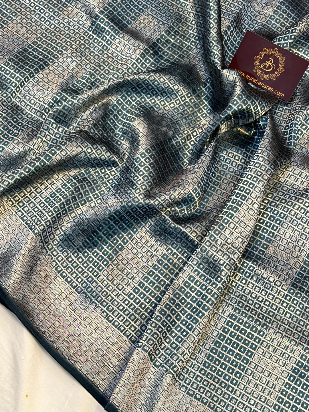 Intricate silver zari geometric brocade design on pure Katan silk Banarasi saree