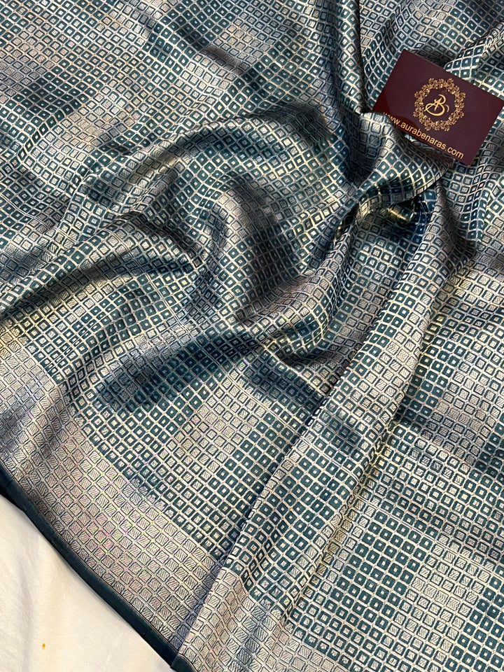 Intricate silver zari geometric brocade design on pure Katan silk Banarasi saree