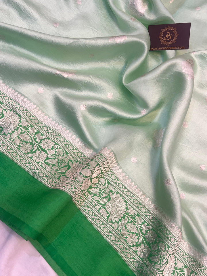Intricate silver zari Kadhwa buta and buti on Banarasi pure silk saree