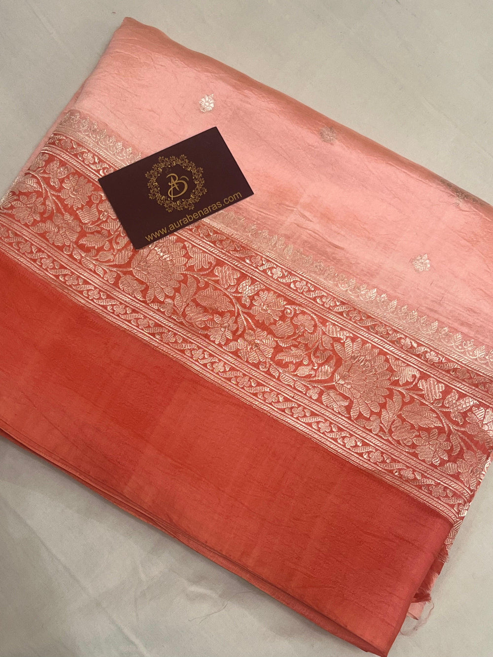 Intricate silver zari Kadhwa buta and buti on Banarasi pure silk saree